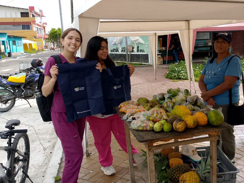 Members of Patitas Azules promoting environmental awareness by collecting garbage in the Galapagos Islands