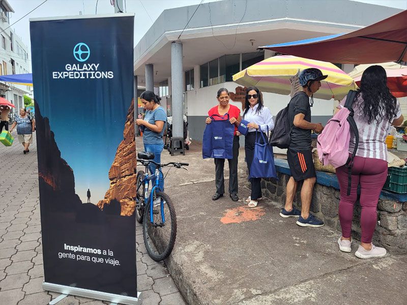 Members of Patitas Azules promoting environmental awareness by collecting garbage in the Galapagos Islands