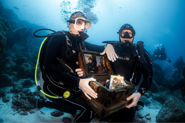 An intrepid and romantic marriage proposal in the Galapagos deep Female Diver Showing Hand